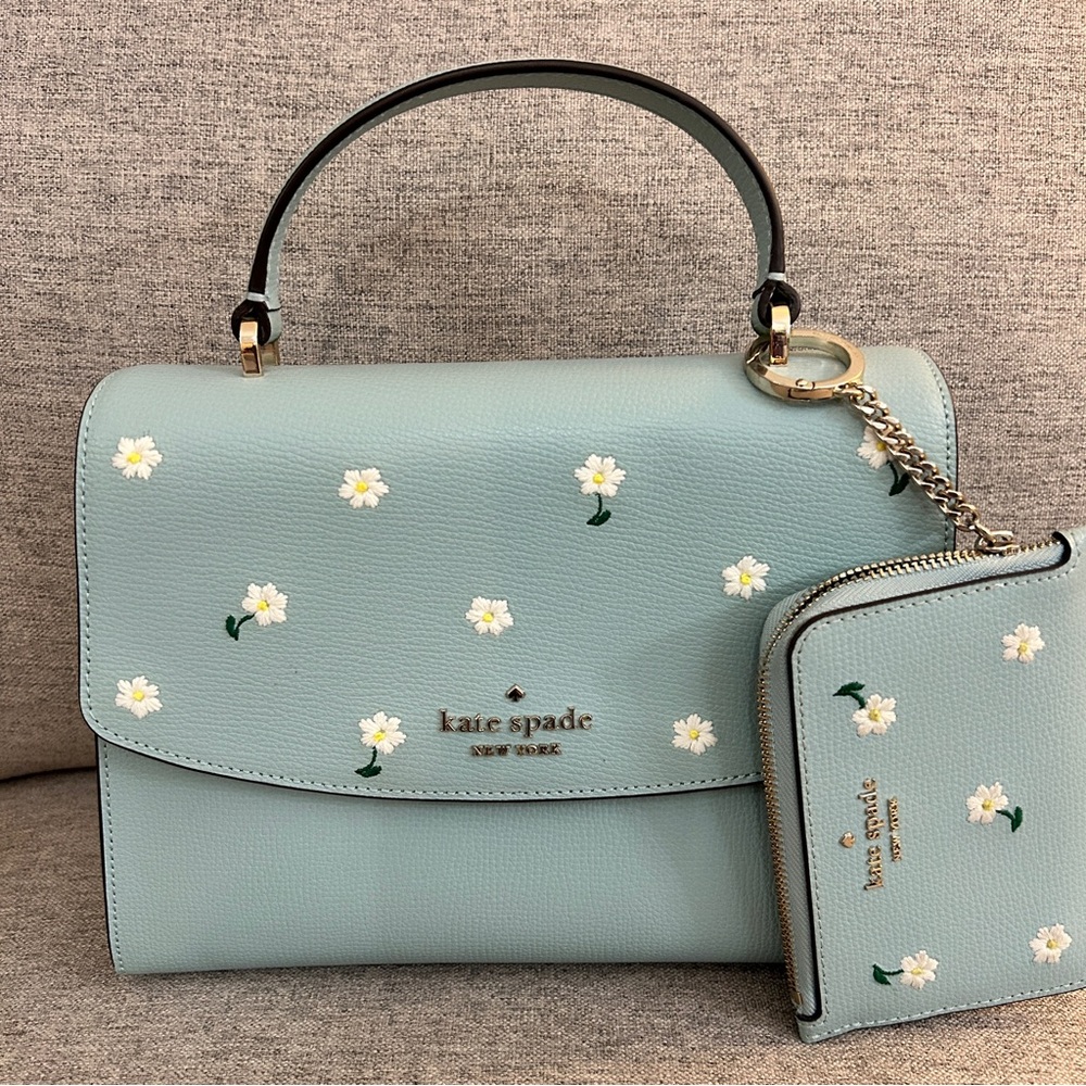 kate spade light blue satchel with white daisy print